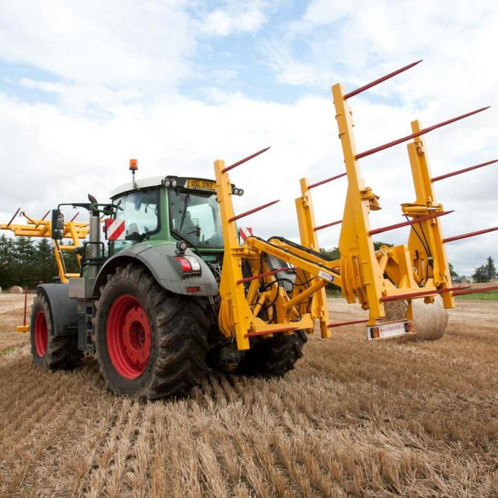 cta-Quad Bale Handling System - front and rear sections for carrying 12 round bales or 6 Heston bales at a time. Showing the hydraulic folding version.